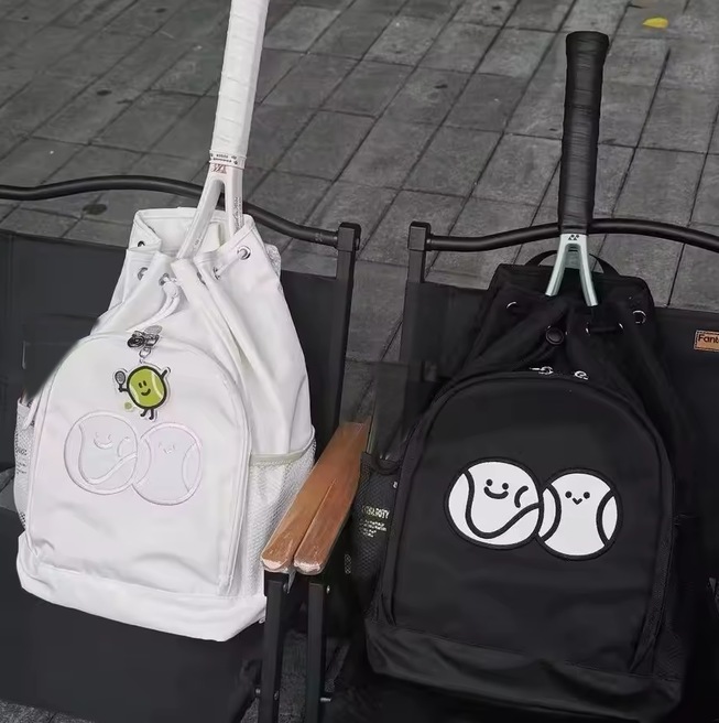 White and black Padel Day racket backpacks side by side